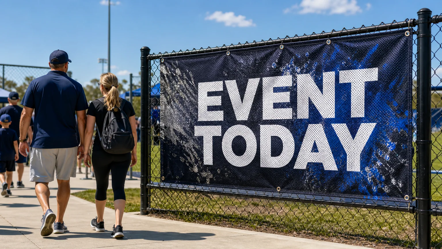 Reinforced mesh banner installed on an outdoor fence